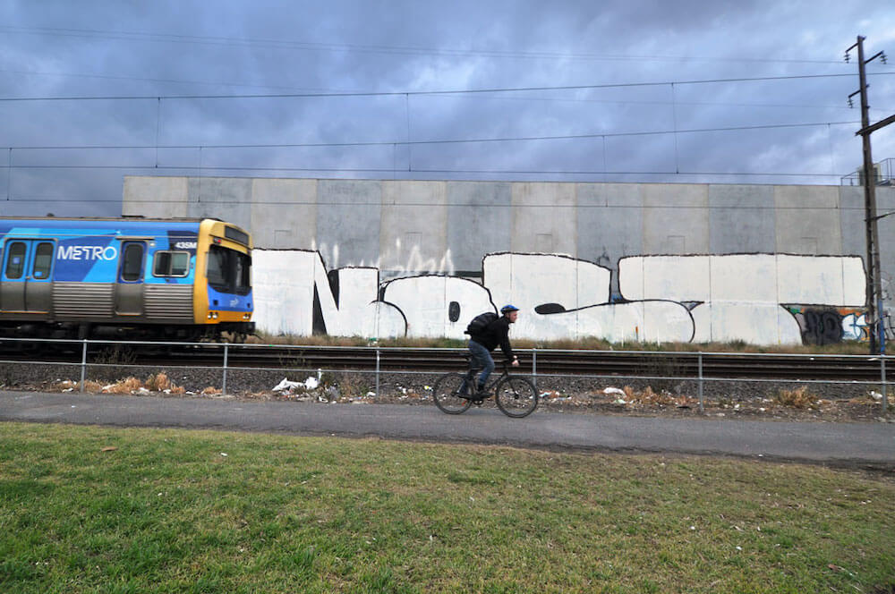 Nost Graffiti in train lane Melbourne