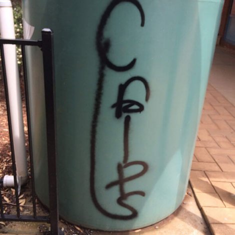 Remove graffiti from water tank