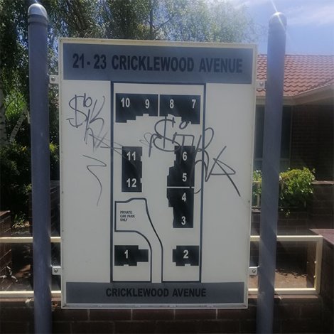 Graffiti removal from street sign